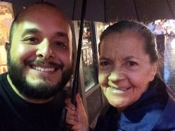 Sharing an umbrella.